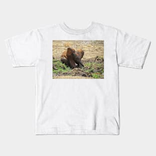 Baby Elephant having a mud bath Kids T-Shirt